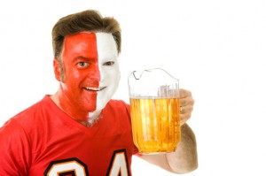 Sports superfan drinking a pitcher of beer