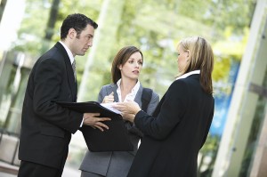 three_business_people_talking